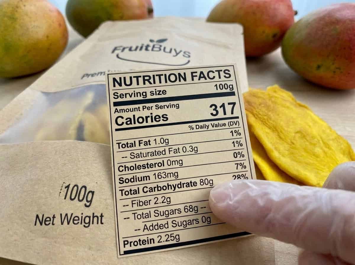 Close Up Of A Dried Mango Nutrition Facts Label Highlighting Zero Grams Of Added Sugars