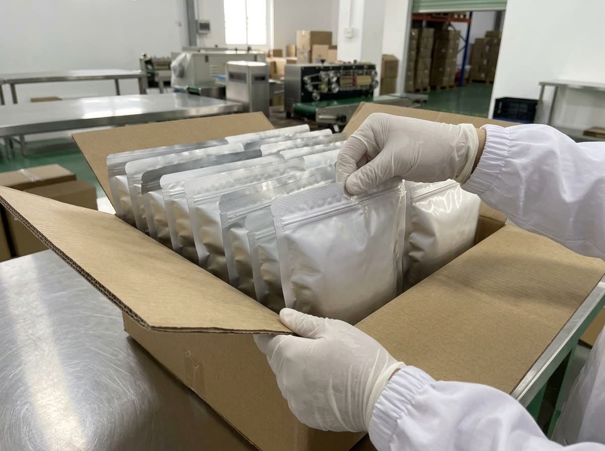 inspection of hermetically sealed aluminum barrier pouches inside master export carton before container stuffing