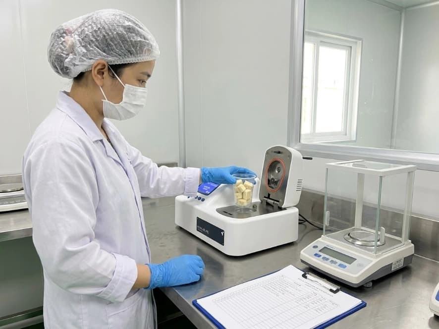 Freeze-Dried Soursop Moisture vs Water Activity qa lab technician measuring soursop sample water activity aw on digital benchtop meter in lab