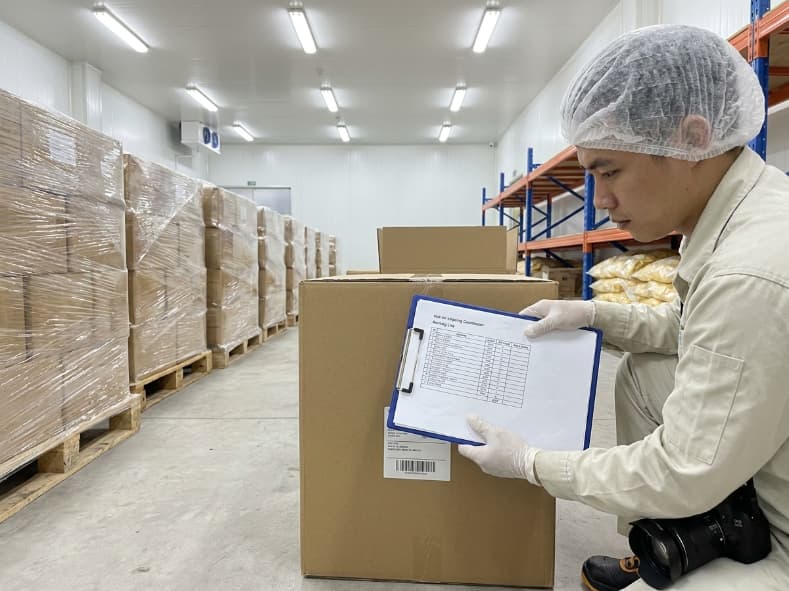 shipping coordinator matching packing list lot codes with master carton labels in export warehouse